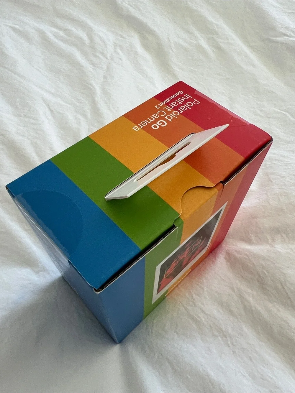NEW, Never Used. Polaroid Go Instant Camera in White with Rainbow Accent